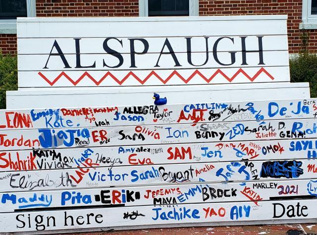 Alspaugh residence hall painted bench sign